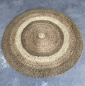 Tricolor round rug with lighter browns