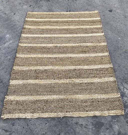 Light brown with tan stripes area rug